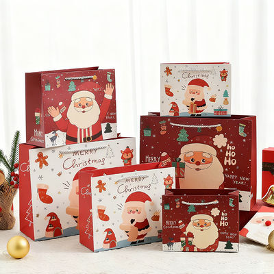 ถุงกระดาษคราฟท์พิมพ์ลายขนาดพิเศษ ถุงของขวัญสุดหรูพร้อมหูหิ้วริบบิ้นสำหรับคริสต์มาส