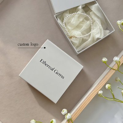 กล่องของขวัญเครื่องประดับแต่งงานหรูหรา โลโก้ที่กําหนดเอง พิมพ์ตู้เก็บของสําหรับแหวนแต่งงาน หูหู สร้อยคอ